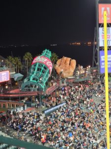 A view of a statue and giant glove at Oracle Park in San Francisco.