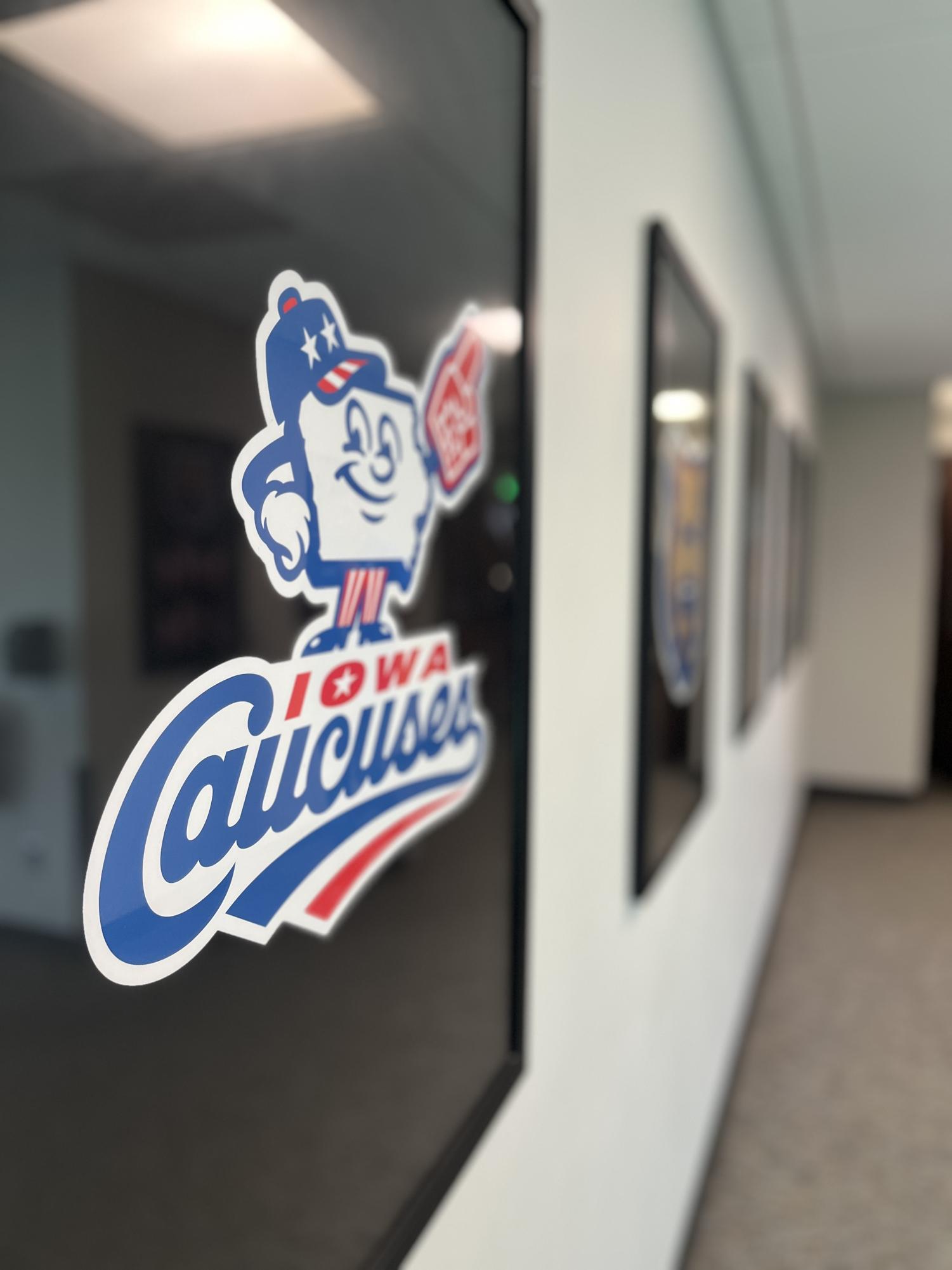 The entrance to Principal Park features framed photos of the five different logos officially used by the Iowa Cubs.