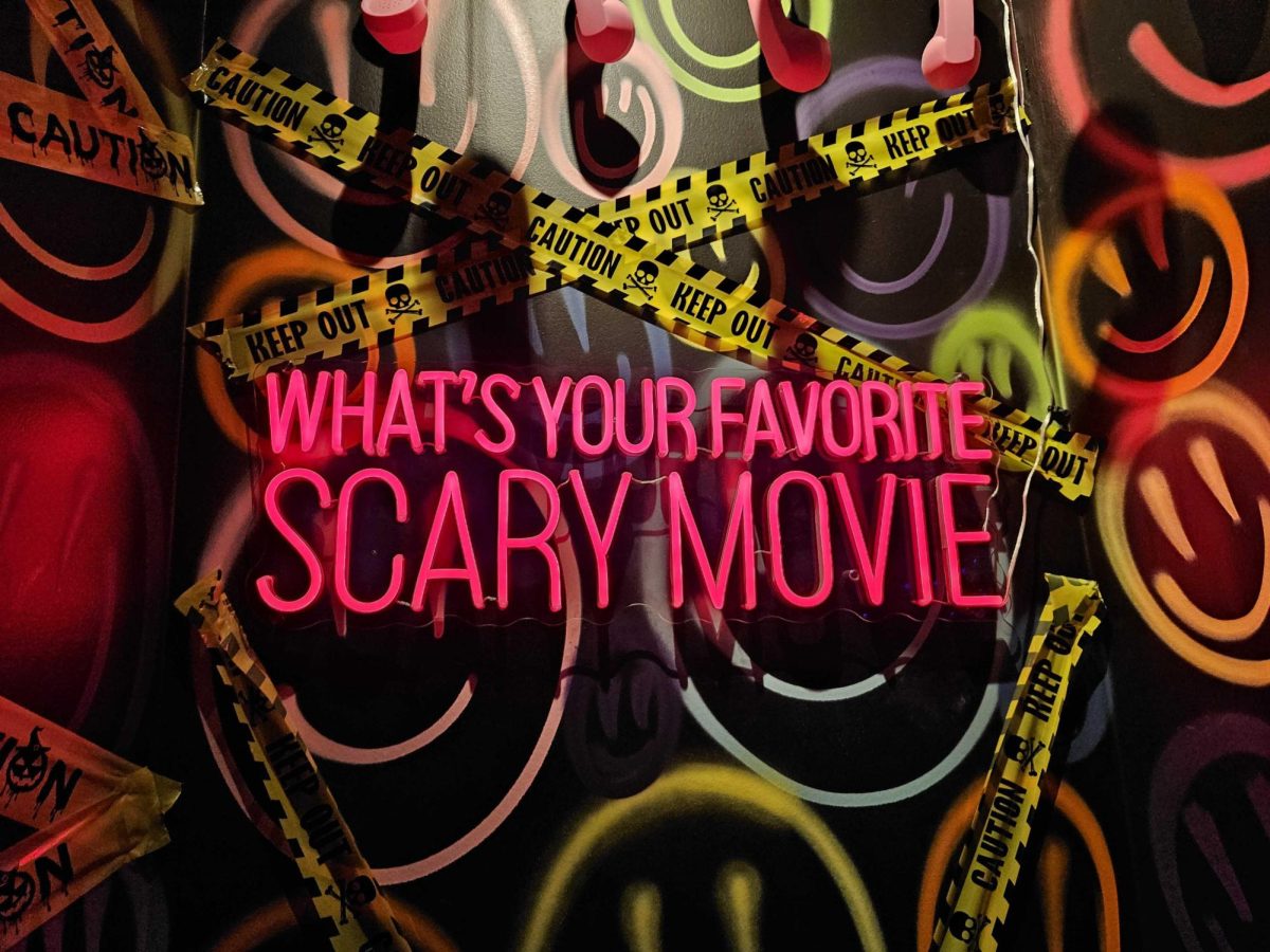 A neon sign at a venue in San Antonio features a famous quote from the popular 1996 horror film "Scream."